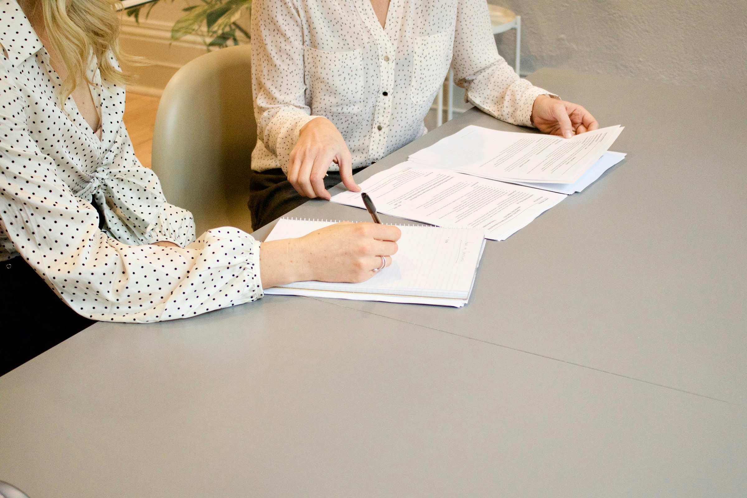 Quality professionals reviewing and signing documents